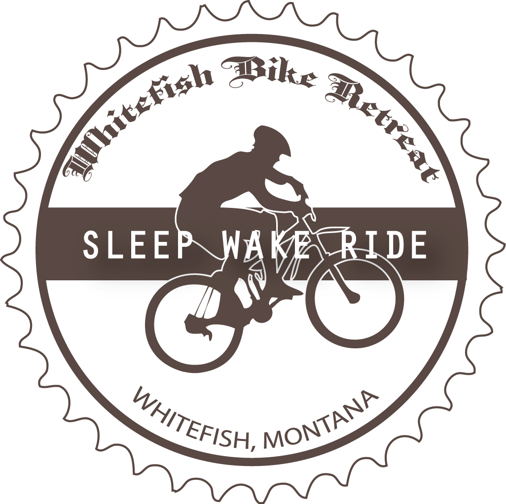Sticker in the shape of a bike cog with the Whitefish Bike Retreat text and a mountain biker.